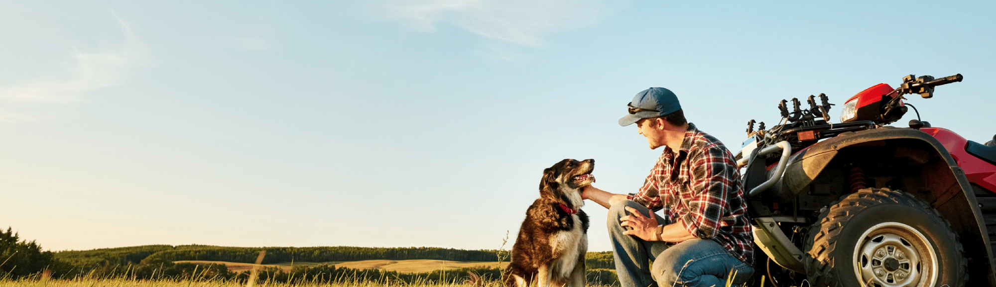 Man with dog in field