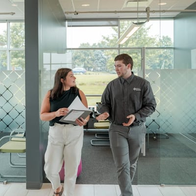 CCCU Member and employee walking in CCCU branch