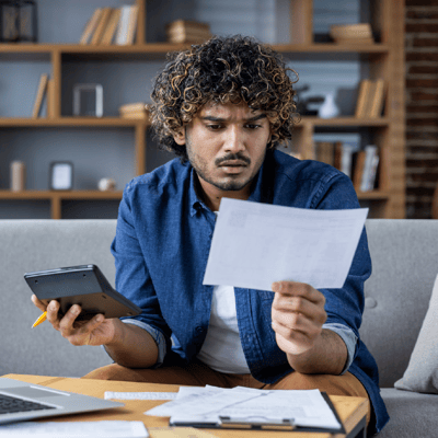 Man planning finances at table