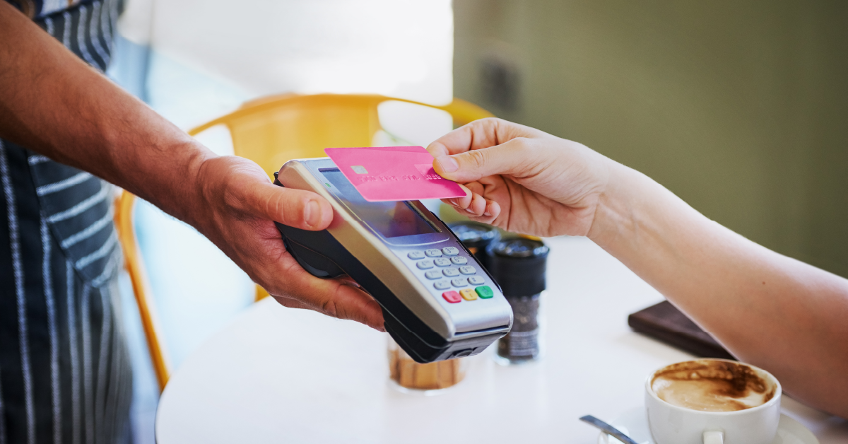Person paying with pink credit card