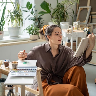 Artist working on a painting