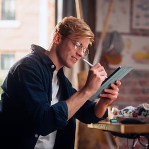 Artist working on his tablet