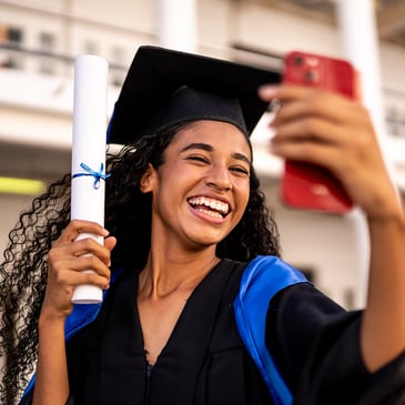 college graduate taking selfie