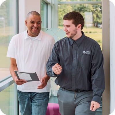 CCCU employee walking with member