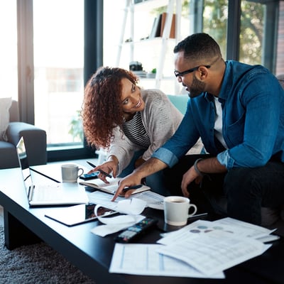 Couple reviewing finances together at home