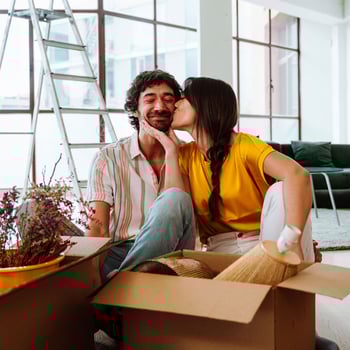 couple unpacking in new home