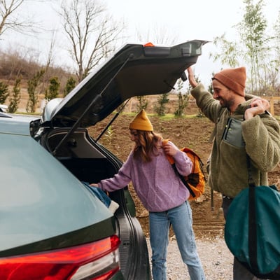 Couple grabbing hiking gear