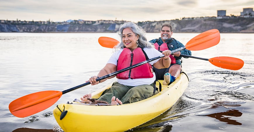 Empty nesters kayaking on a lake