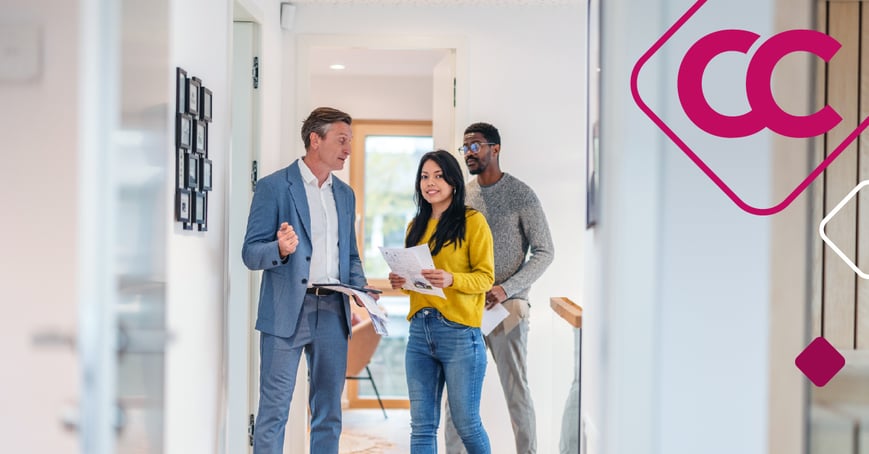 Couple touring a home with a realtor 