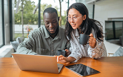 Couple Looking At Laptop