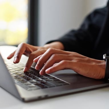 hands-typing-on-laptop