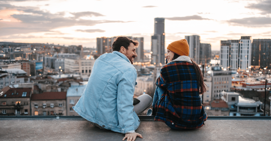 Couple sitting on roof