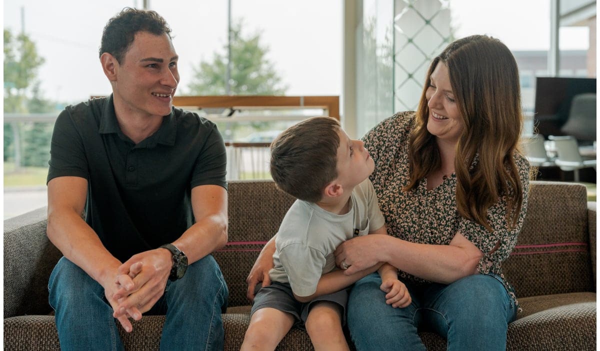 Family sitting inside CCCU branch