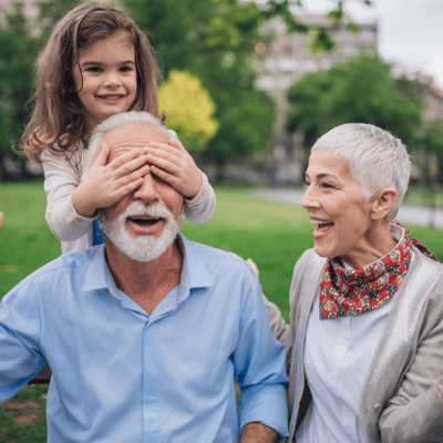 Grandparents playing with grand daughter