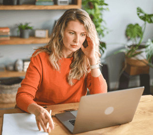Woman looking at her personal laptop