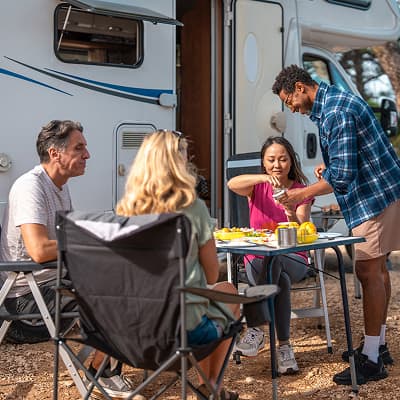 Family camping outside RV