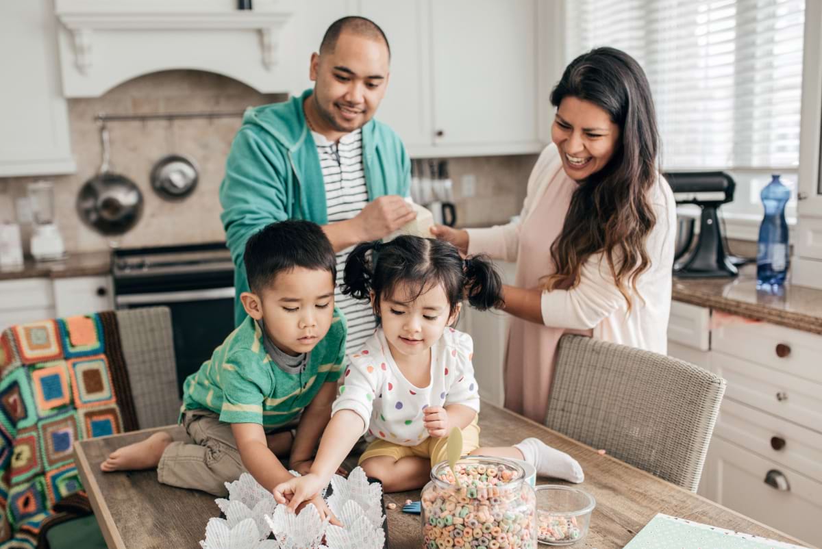 family of four in the kitchen