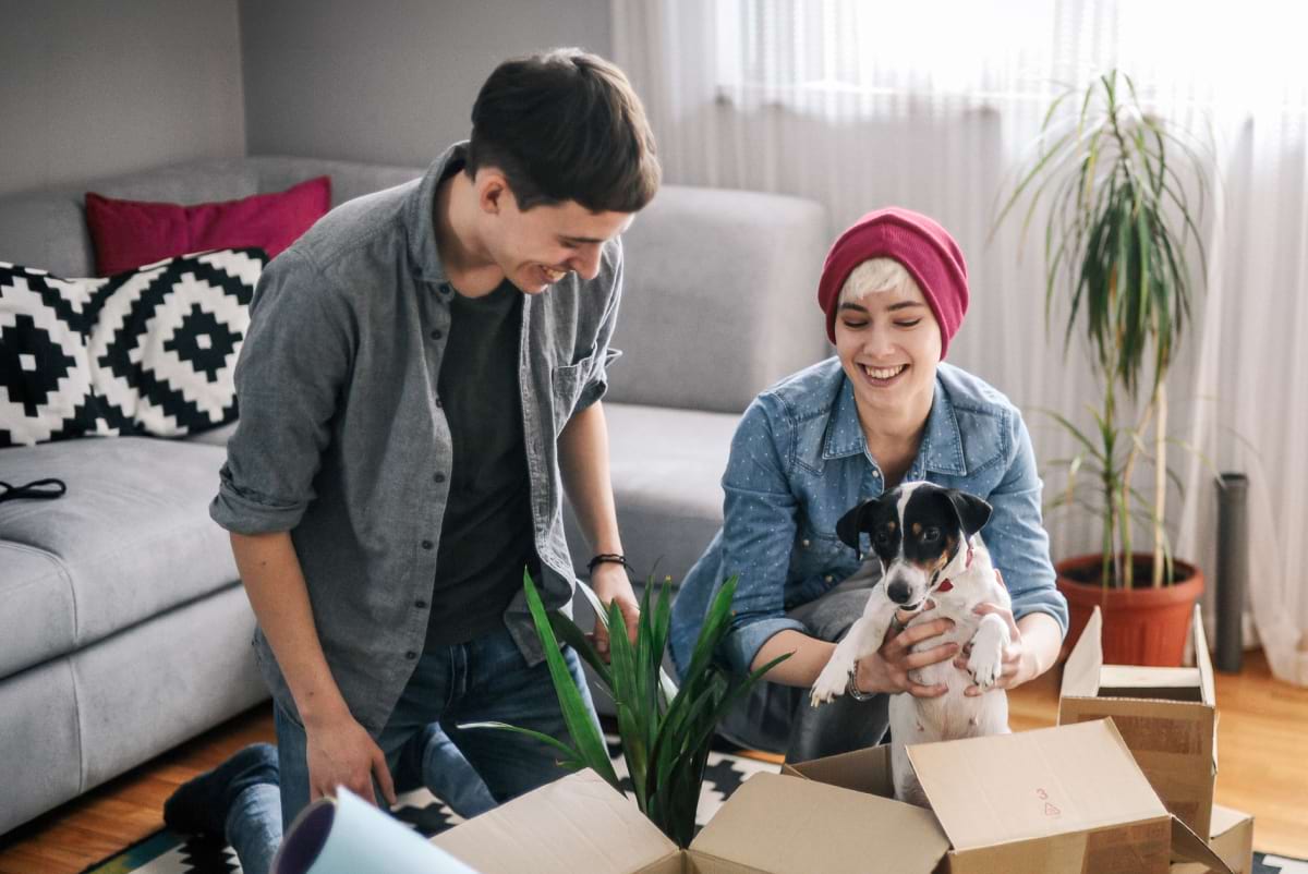 couple petting their dog