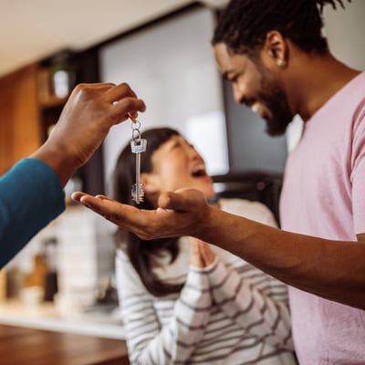 Couple getting keys to new home