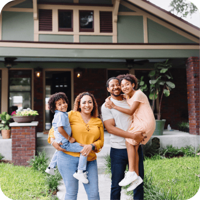 Family in front of their house