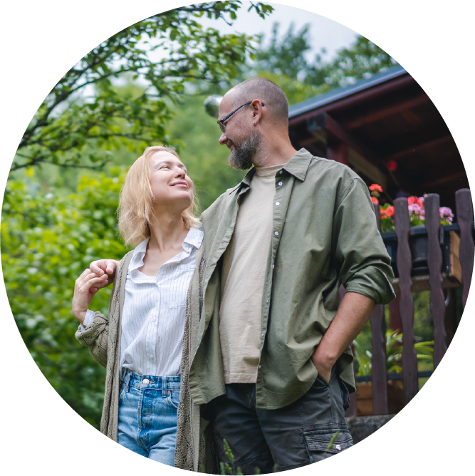 Man and woman standing in front of their home
