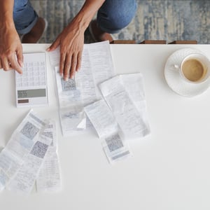 Receipts on table with calculator