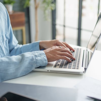 Person typing on laptop