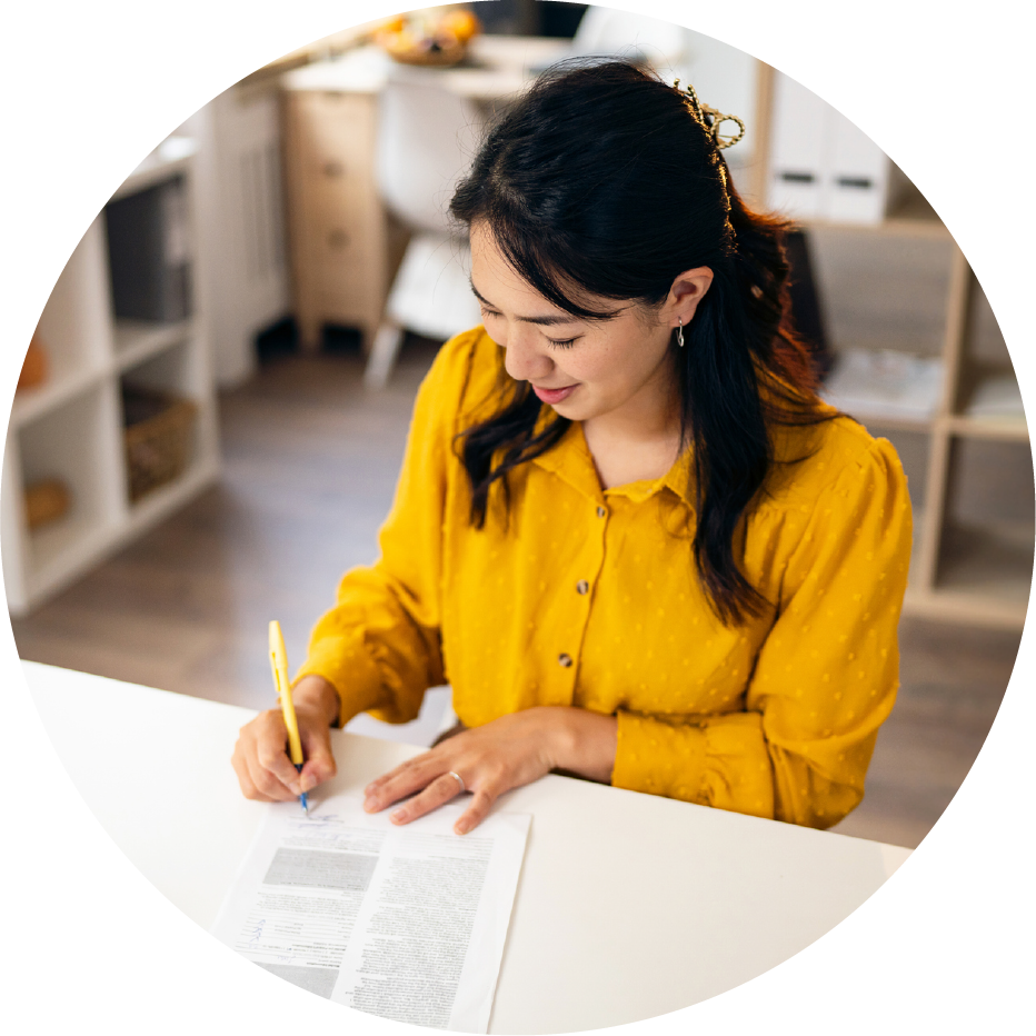 Woman signing for home loan